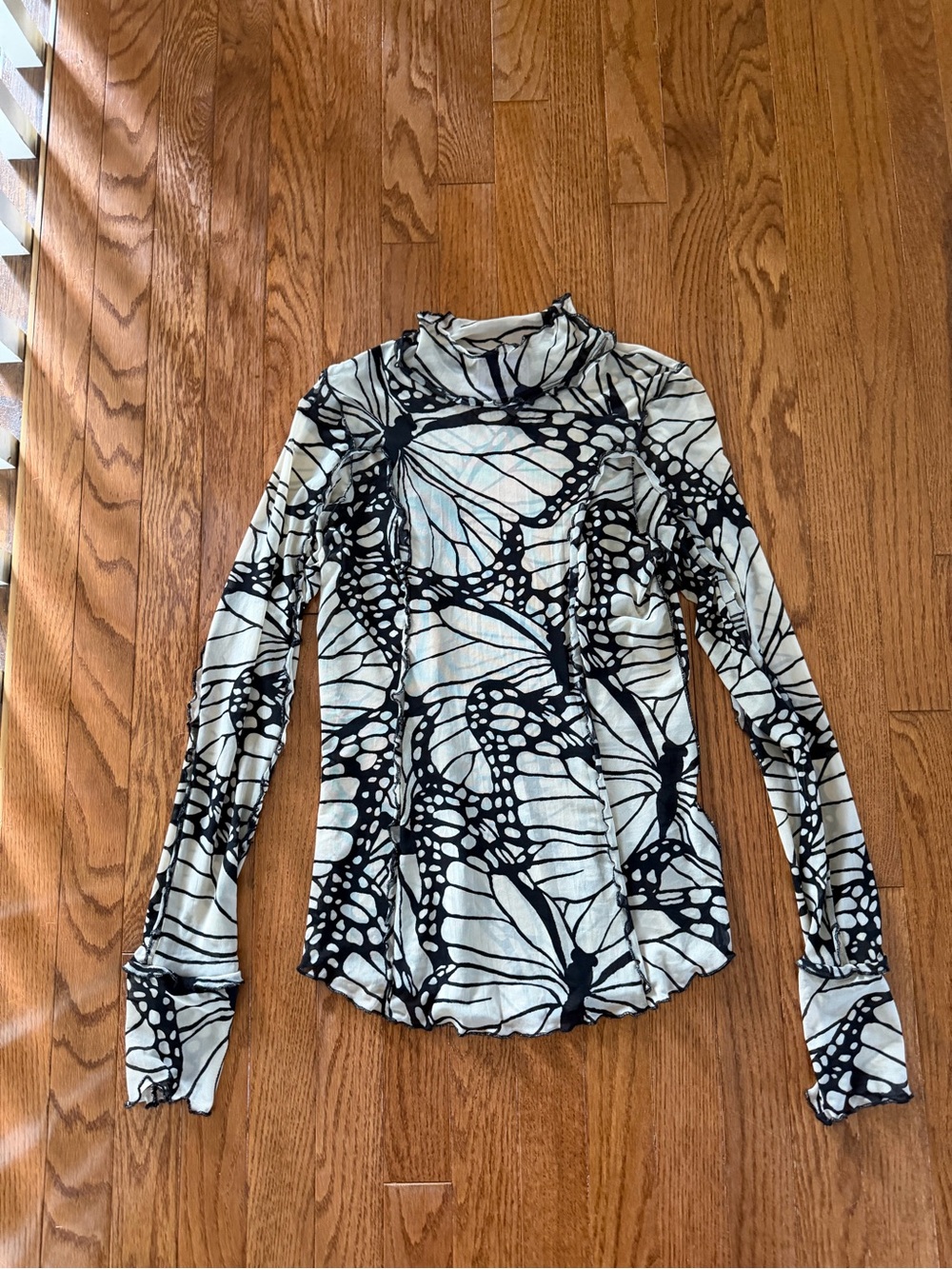 Free People Ivory Long-Sleeve Turtleneck with Black Butterfly Motif